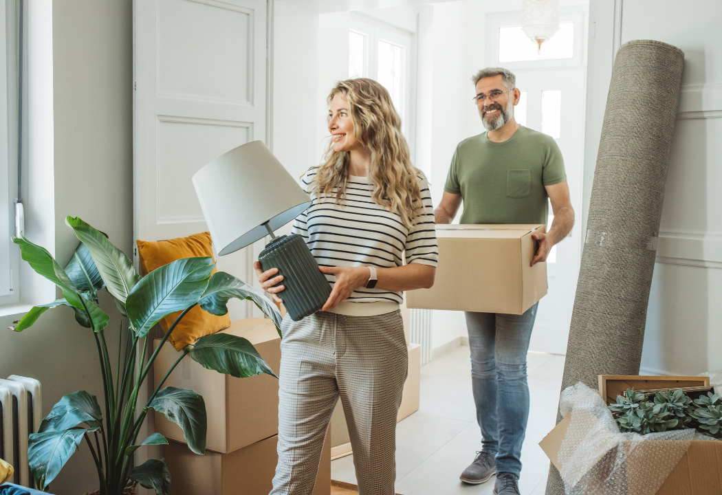 middle aged couple moving into new home